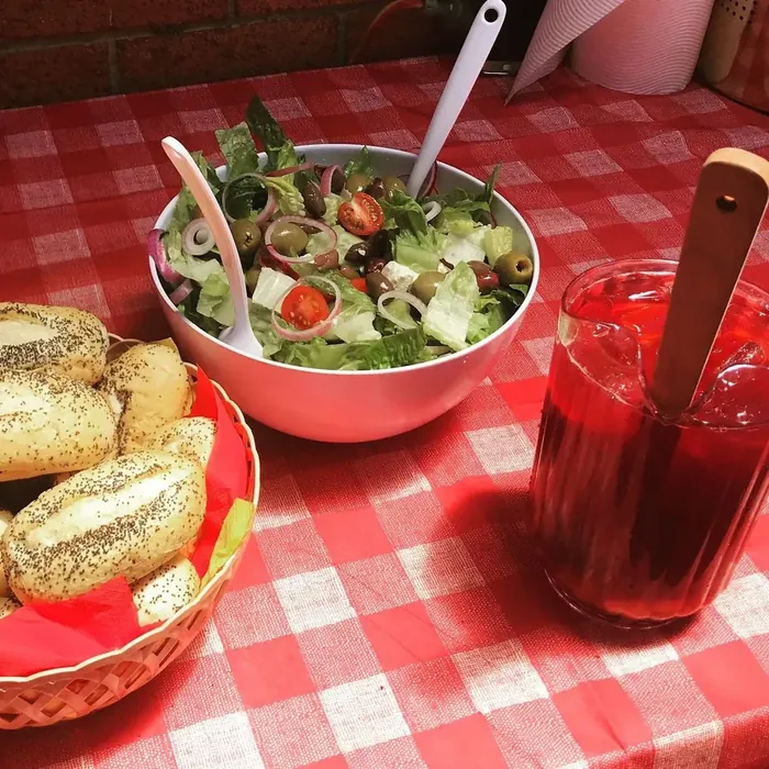 Sides and sangria, fresh green salad and dinner rolls